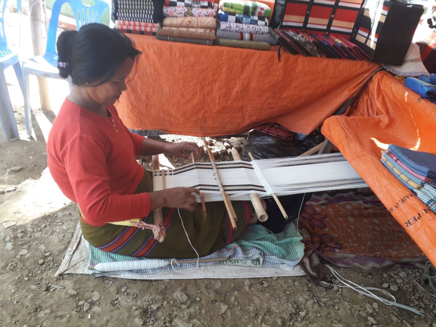 Weaving on a traditional backstrap loom, Bandarban
