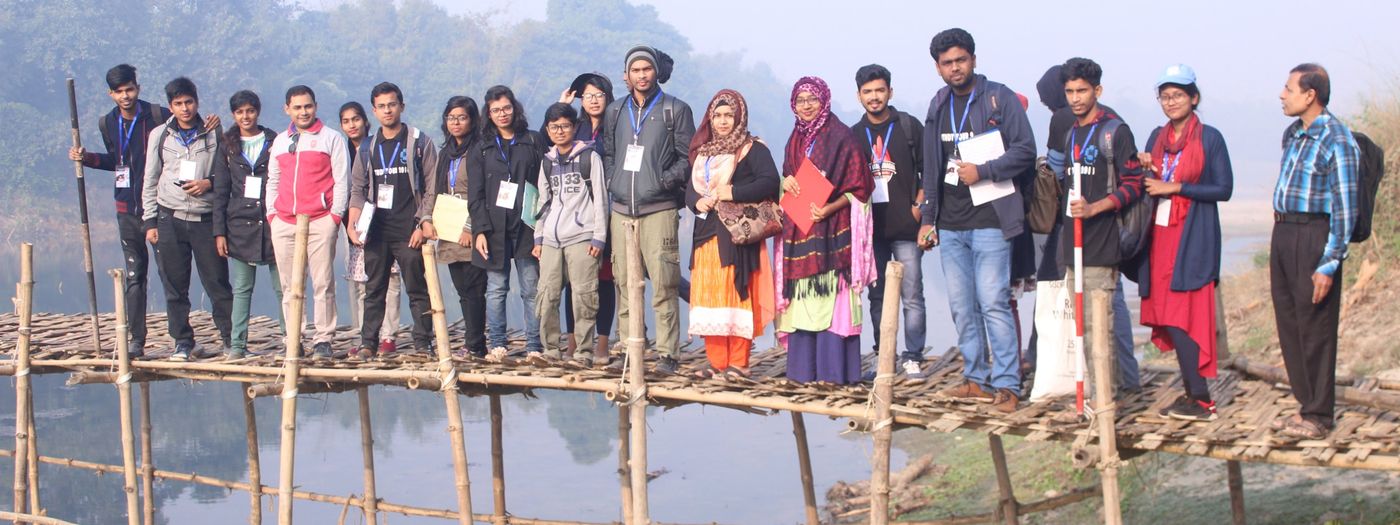 On a bamboo bridge at the river cross-section site
