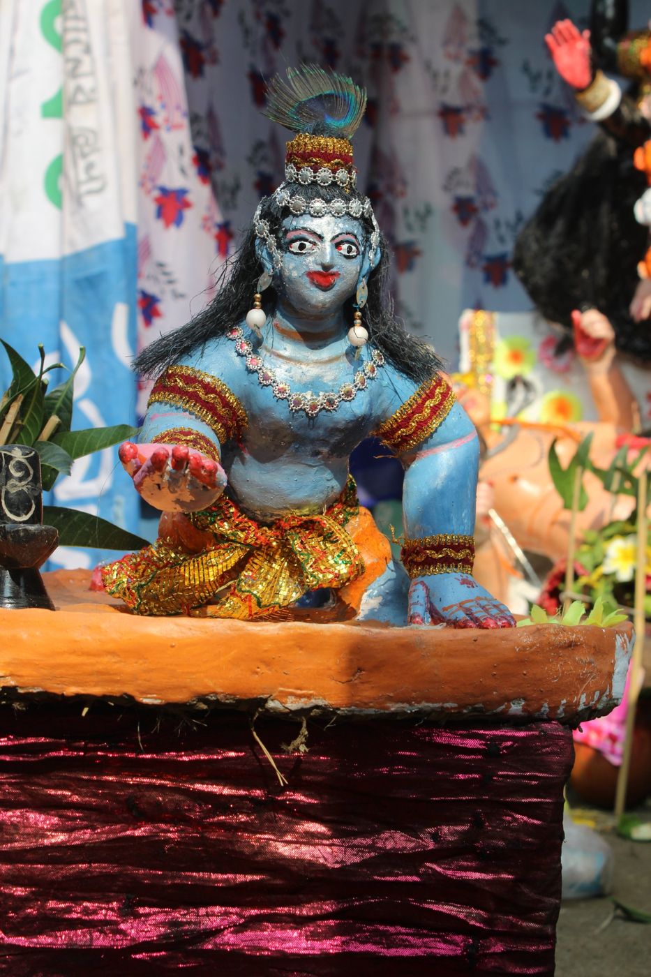 A clay figure of Krishna at the fair