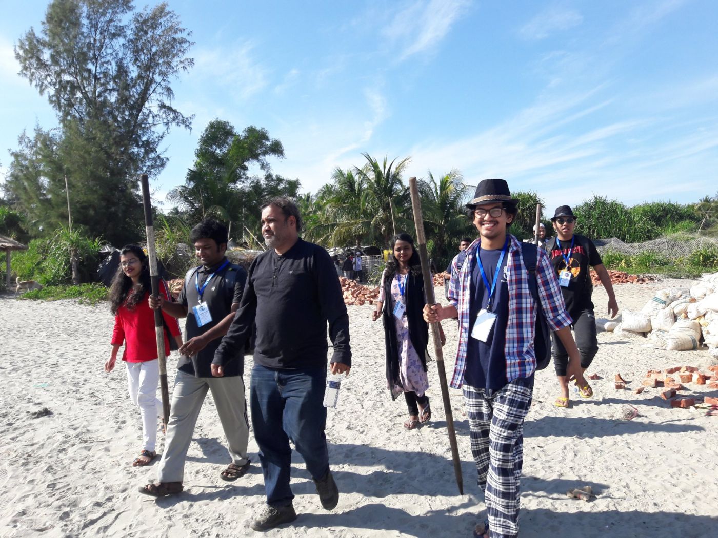 Heading out for beach profiling with ranging poles