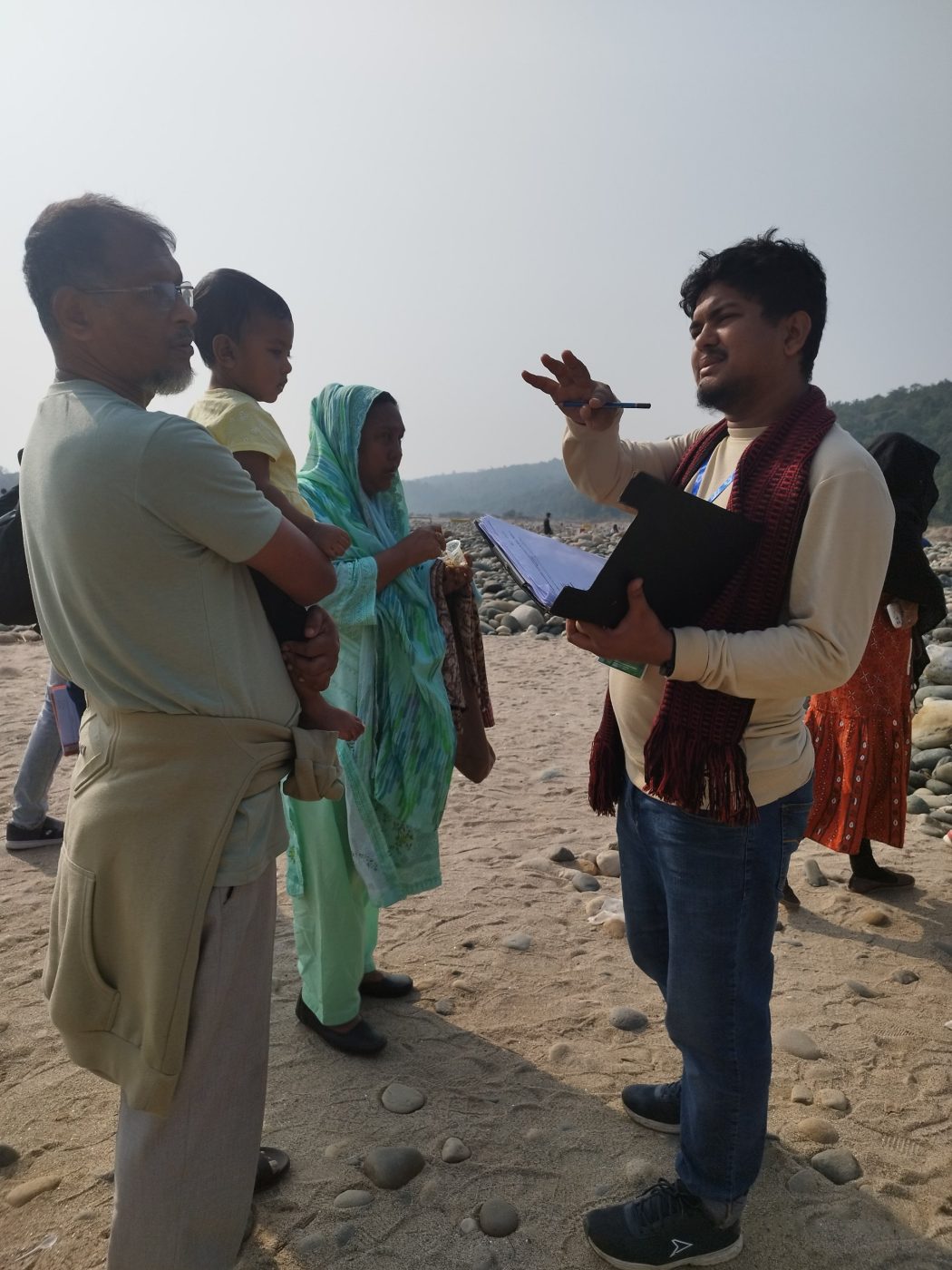 Interviewing visitors on a stony riverbed