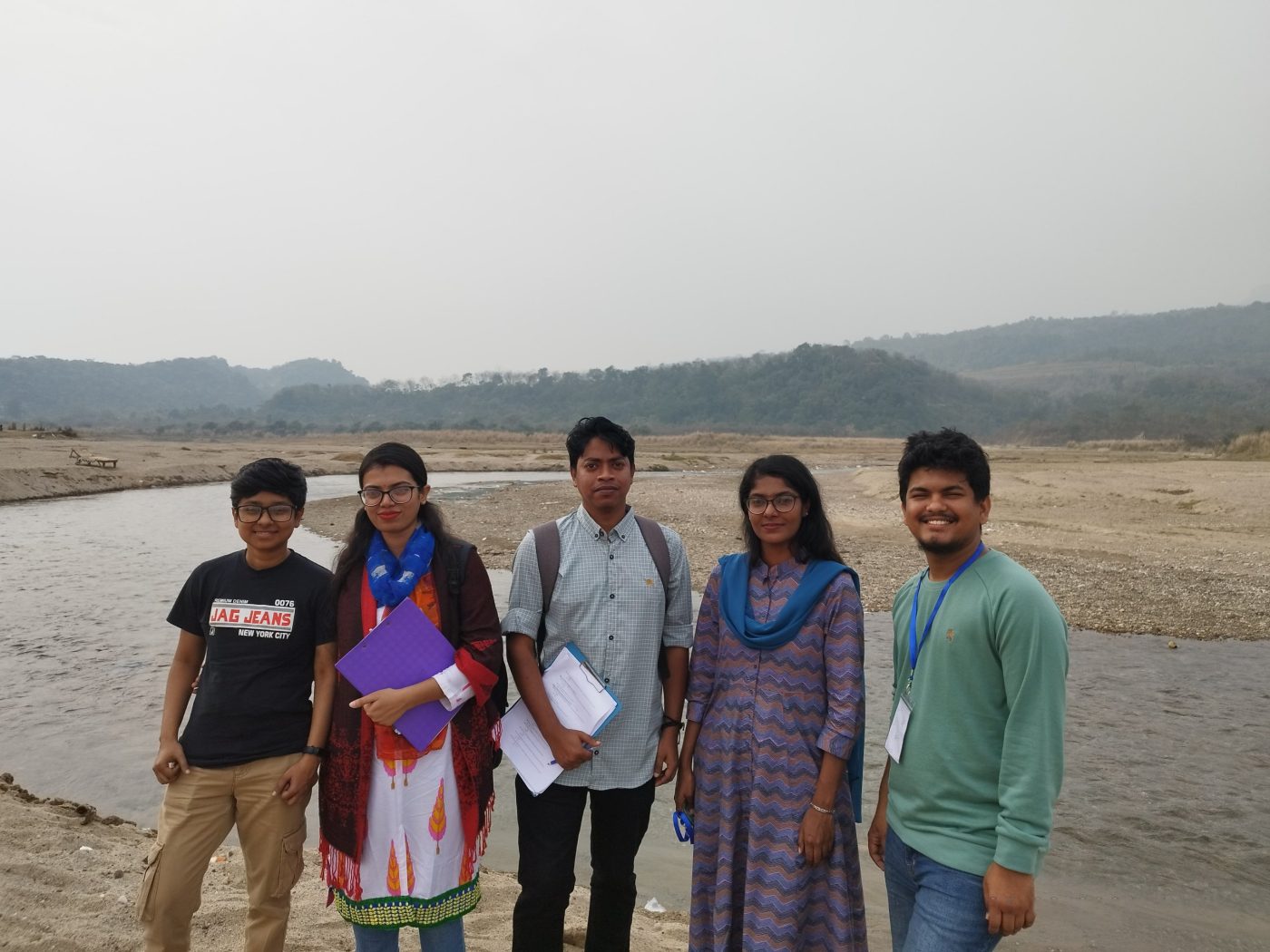 Our survey team by a hill river